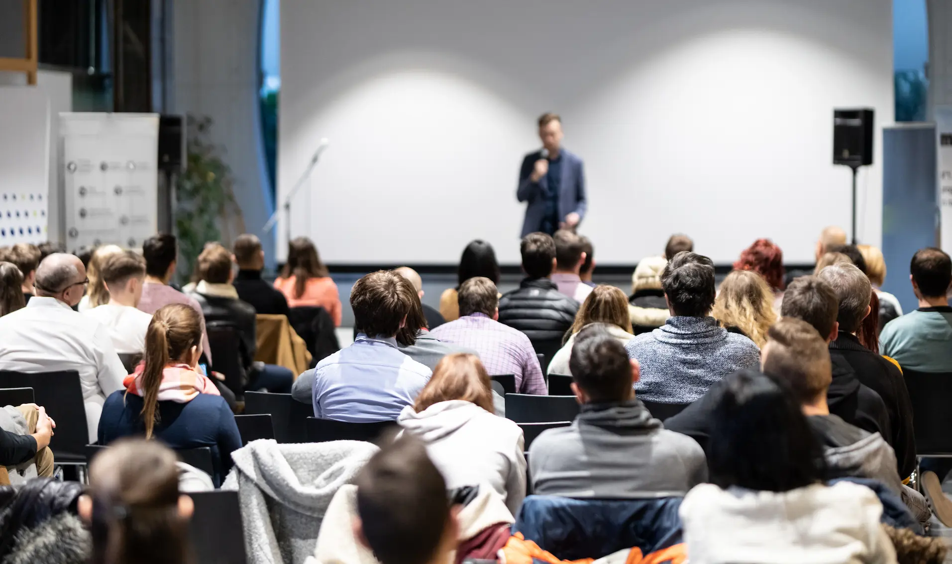 speaker-giving-talk-conference-hall-business-event-audience-conference-hall